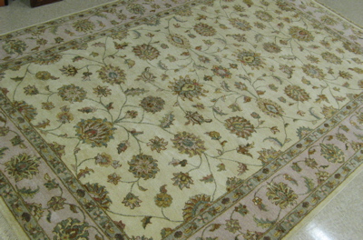 Appraisal: PAKISTANI KASHAN CARPET overall scrolling floral arabesque design on ivory