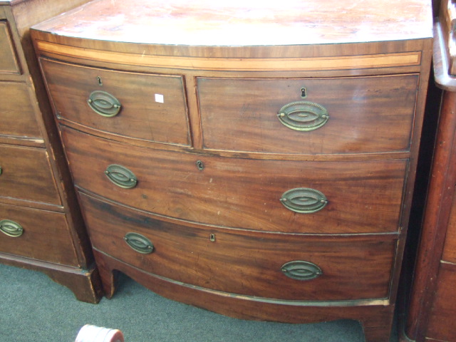 Appraisal: A Regency mahogany bowfront chest of two short and two