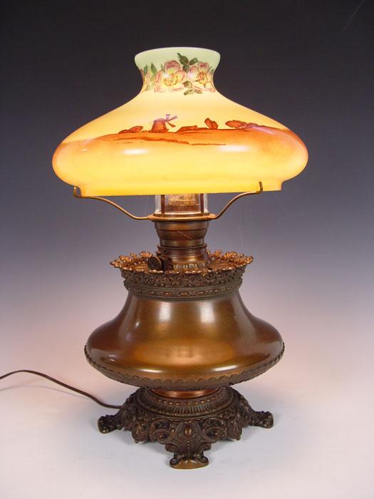 Appraisal: SIGNED HANDEL REVERSE PAINTED BRASS OIL LAMP Converted oil lamp