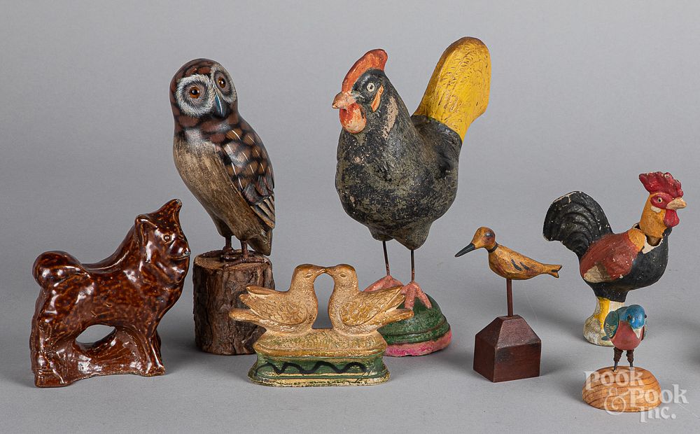 Appraisal: Seven pottery and carved wood animals Seven pottery and carved