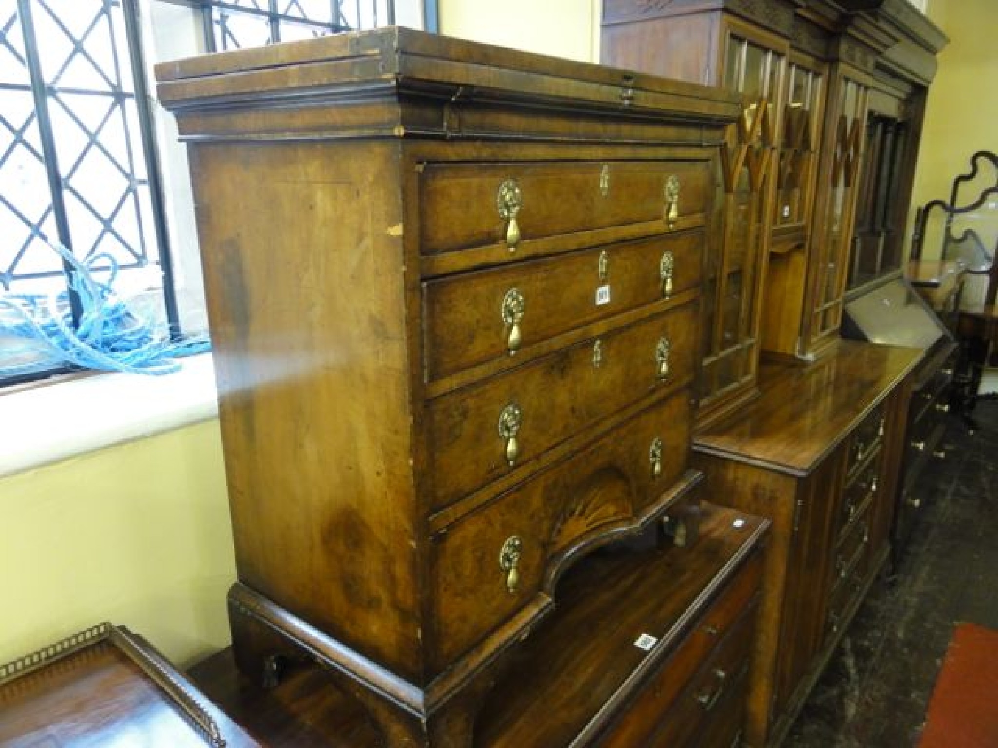 Appraisal: A George II style walnut and figured walnut bachelors chest