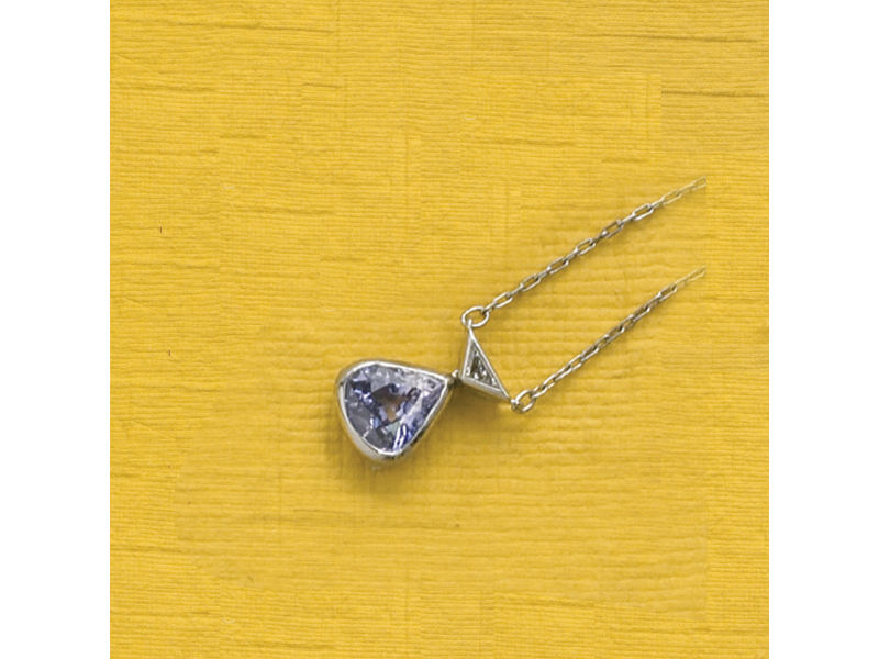 Appraisal: PURPLE SAPPHIRE AND DIAMOND PENDANT A platinum pendant and chain