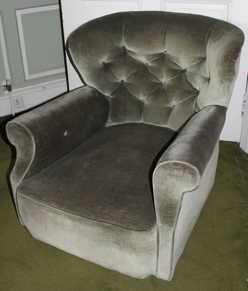 Appraisal: An early thC armchair upholstered in buttoned dralon on castors