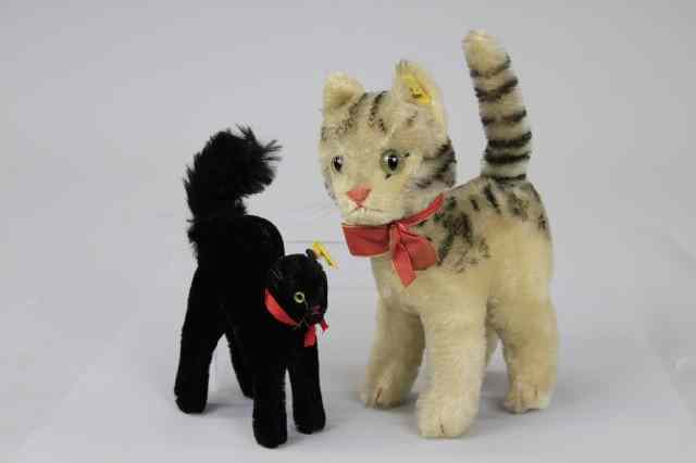 Appraisal: TWO GLASS EYE STEIFF CATS Includes white Steiff kitten with