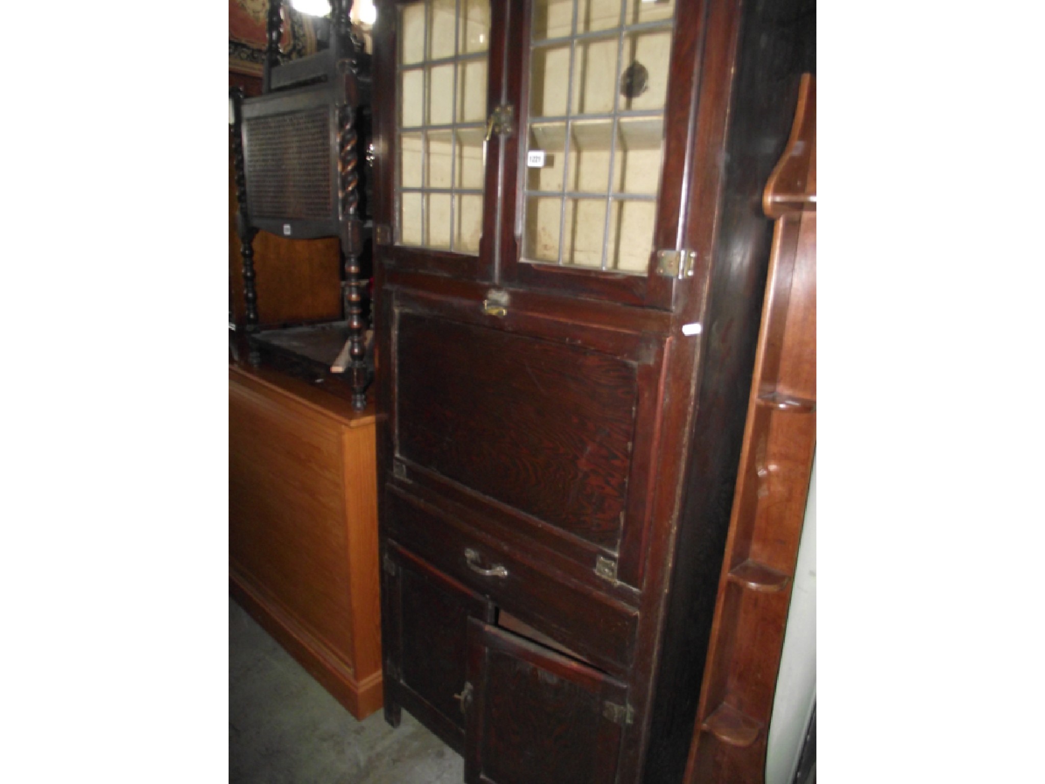 Appraisal: A 's oak 'Kitchen Queen' type cabinet with leaded light