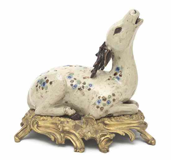 Appraisal: A Gilt Metal Mounted Stoneware Model of a Deer the