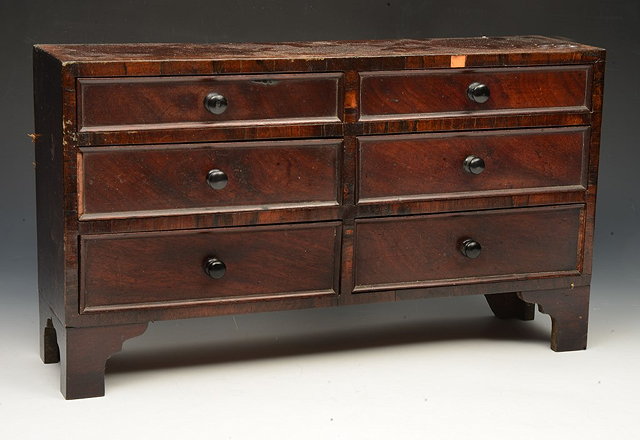 Appraisal: A LATE GEORGE III MAHOGANY MINIATURE CHEST the top with