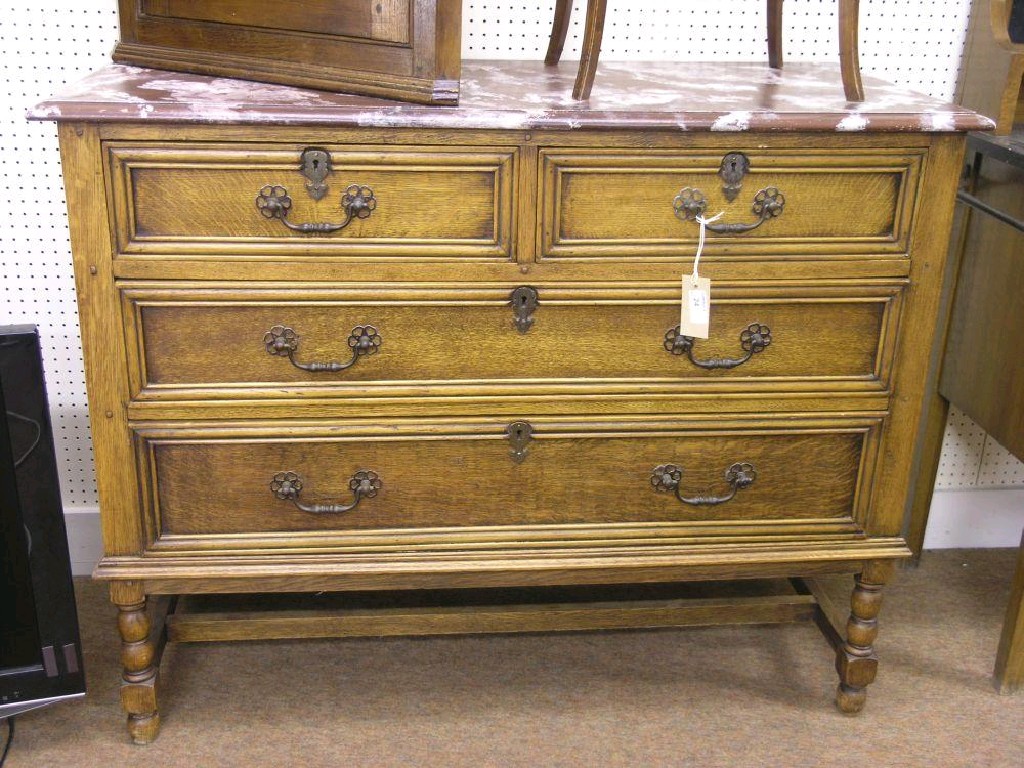 Appraisal: A solid medium oak dressing chest with marbled top two