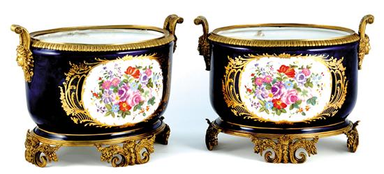 Appraisal: Pair French style cachepots oval cylinder form with floral cartouche