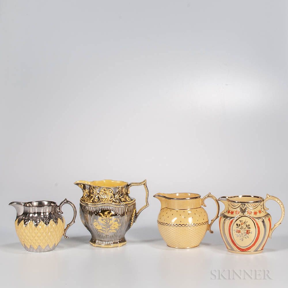 Appraisal: Four Staffordshire Yellow-glazed Molded Jugs Four Staffordshire Yellow-glazed Molded Jugs