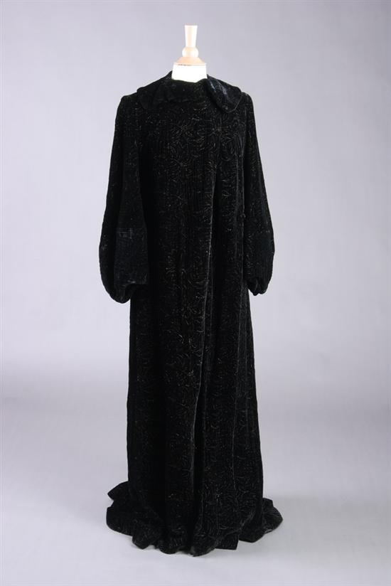 Appraisal: BLACK VELVET OPERA LENGTH COAT Circa s With stitched copper