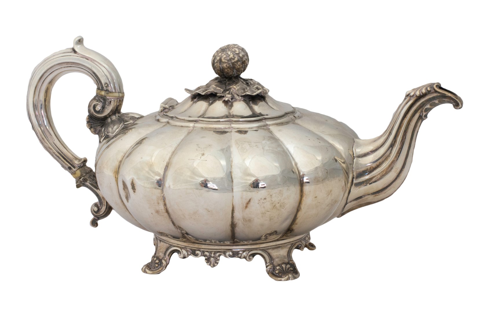 Appraisal: A George IV silver teapot of compressed melon form with