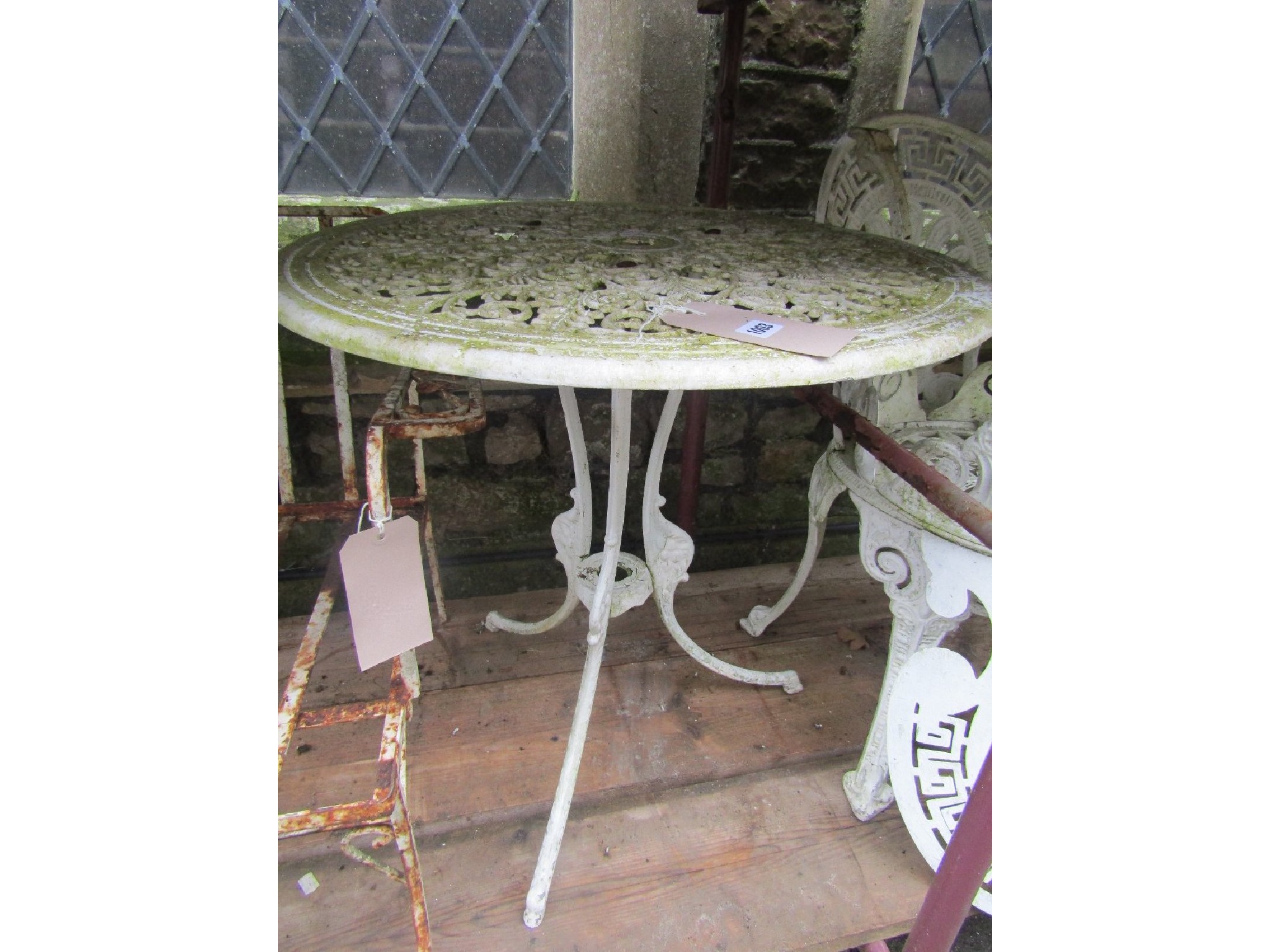 Appraisal: A Victorian style cream painted cast aluminium garden terrace table