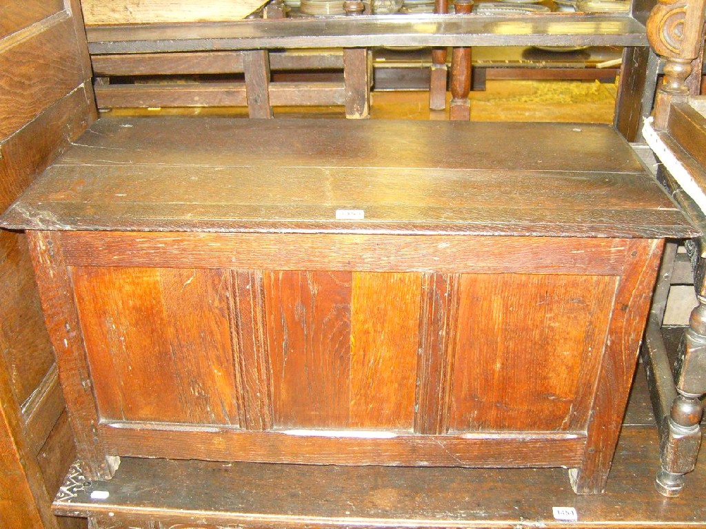 Appraisal: A small oak coffer with panelled frame and moulded styles