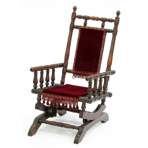 Appraisal: A child's American rocking chair c of stained wood