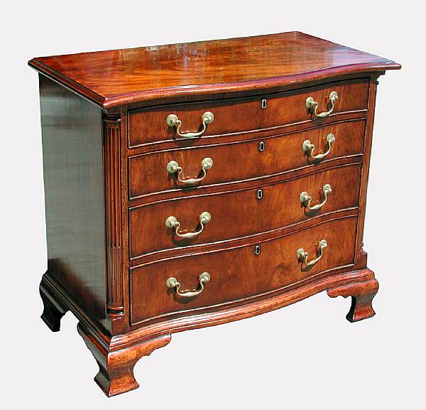 Appraisal: A George III style serpentine mahogany chest of drawers The