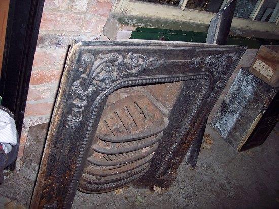 Appraisal: A Victorian cast iron fire surround cm x cm x