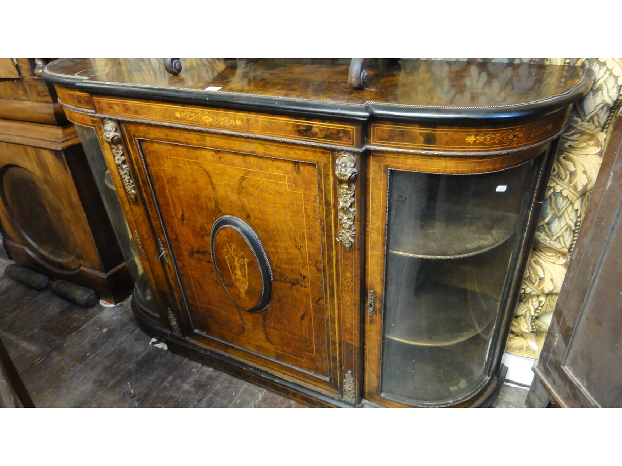 Appraisal: A Victorian walnut and figured walnut 'D' end credenza the