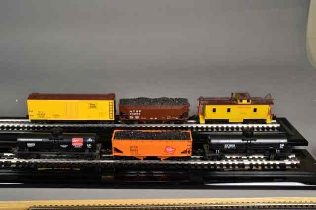 Appraisal: LIONEL BOXCARS COALCARS CABOOSEIncluding yellow Rock Island freight car two