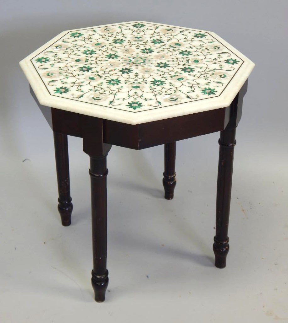 Appraisal: A mahogany coffee table with a marble octagonal top inlaid