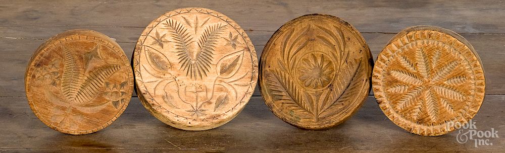 Appraisal: Four carved and turned butterprints Four carved and turned butterprints