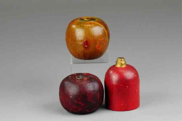 Appraisal: LOT OF THREE POTTERY STILL BANKS Includes two apples and