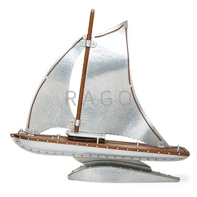 Appraisal: HAMMERED COPPER AND ALUMINUM SAILBOAT MODEL Riveted design mid th