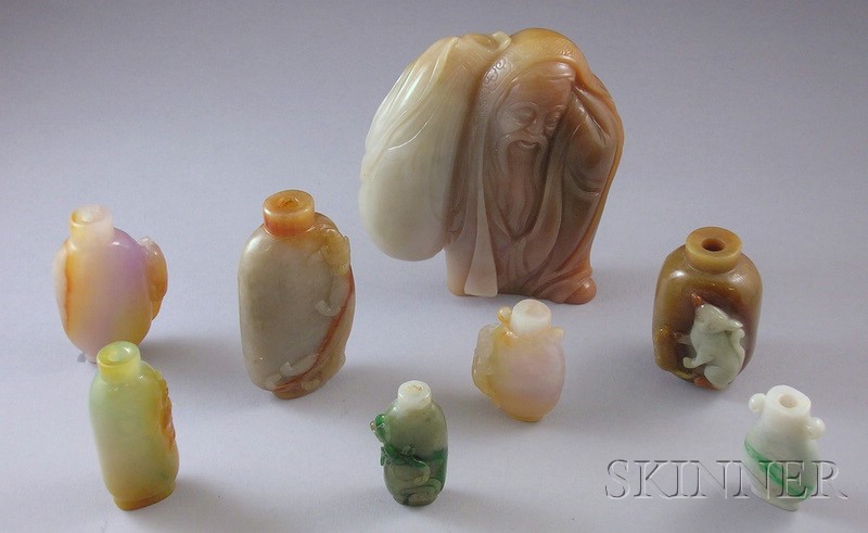 Appraisal: Eight Jade and Stone Carved Snuff Bottles including large figure