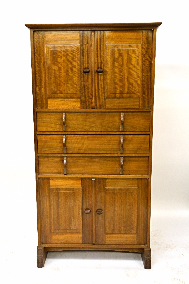 Appraisal: An Australian walnut tallboy by Peter Waals the moulded projecting