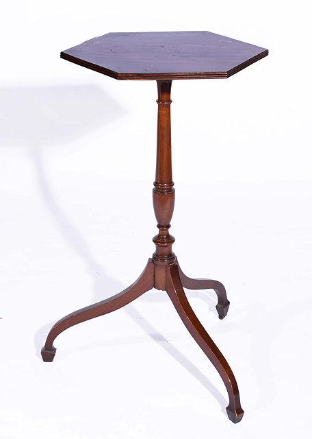 Appraisal: A MAHOGANY WINE TABLE with hexagonal top and turned central