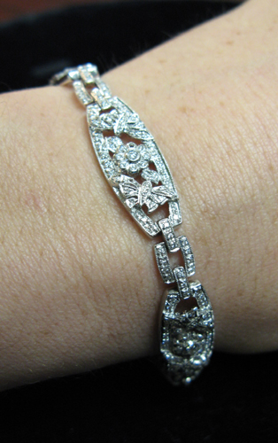 Appraisal: DIAMOND AND FOURTEEN KARAT WHITE GOLD BRACELET the entire length