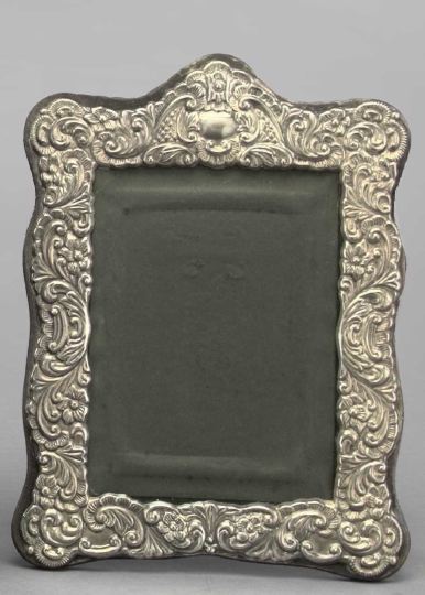 Appraisal: Embossed Sterling Silver-Faced Photograph Frame of upright oblong form in