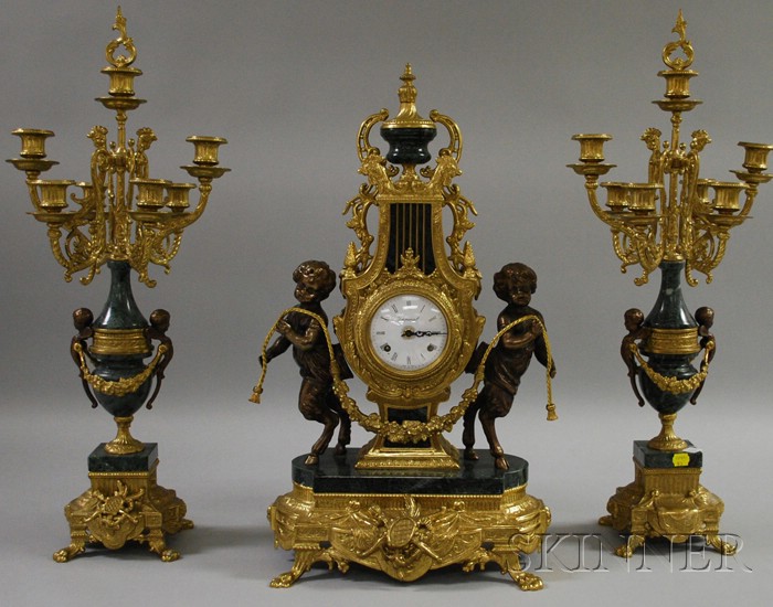 Appraisal: Italian Brass and Marble Clock Garniture th century with Roman