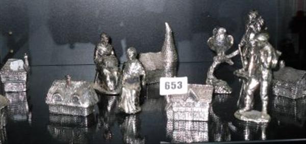 Appraisal: A collection of white metal figural houses tradespersons an owl