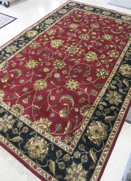 Appraisal: HAND KNOTTED ORIENTAL CARPET Indo-Persian scrolling floral Isfahan design on