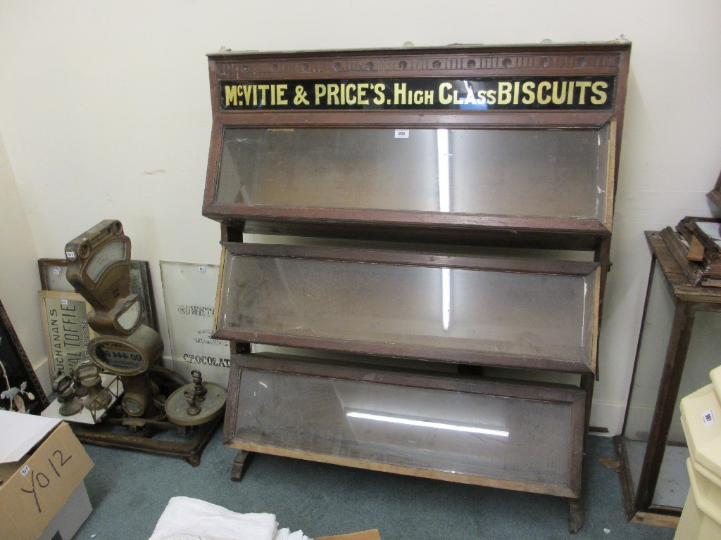 Appraisal: Lot of Edwardian shop biscuit and sweet cabinets and accessories