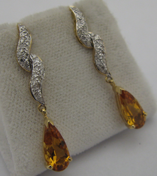 Appraisal: PAIR OF CITRINE DIAMOND AND K GOLD EARRINGS each set