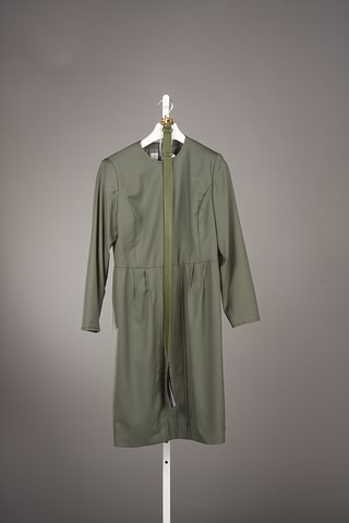 Appraisal: Andr Laug alligator green wool dress with dropped waistline and