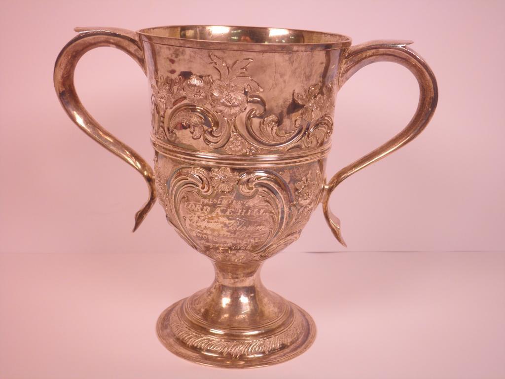 Appraisal: A George III silver two handled cup embossed with foliate