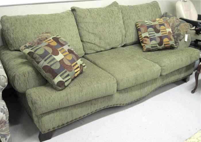 Appraisal: CONTEMPORARY MOSS GREEN SOFA American made with three contrasting throw