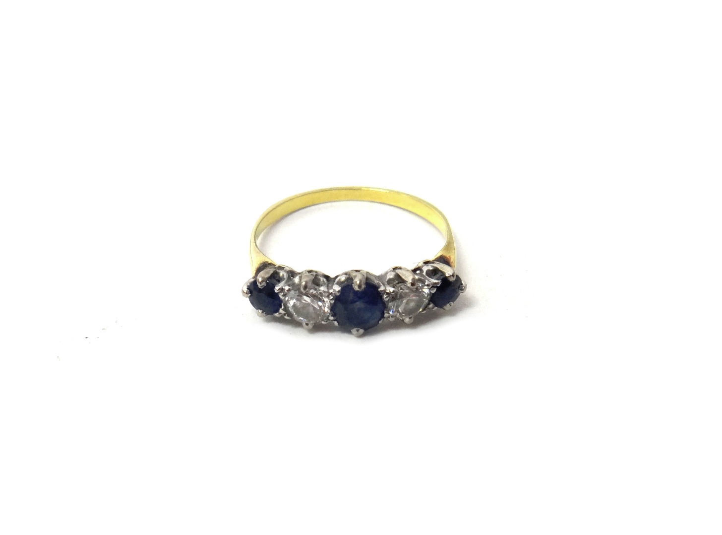 Appraisal: A gold sapphire and diamond set five stone ring claw