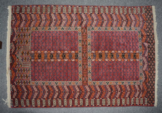 Appraisal: A TEKKE ENGSI TYPE RUG of traditional design with four