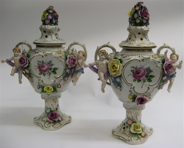 Appraisal: PAIR GERMAN VON SCHIERHOLZ PORCELAIN URNS hand decorated double handled