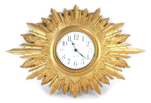 Appraisal: A Hanson Arden Forest gilt plaster cased sunburst clock the