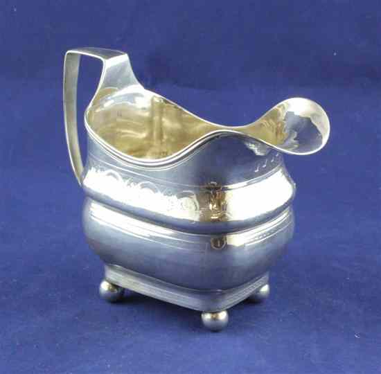 Appraisal: A George III Irish silver cream jug of rounded rectangular