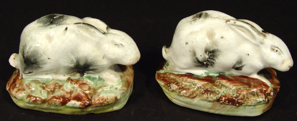 Appraisal: Two early th century Staffordshire hares each with hand painted