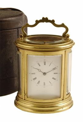 Appraisal: A French gilt brass oval repeating carriage clock by Drocourt