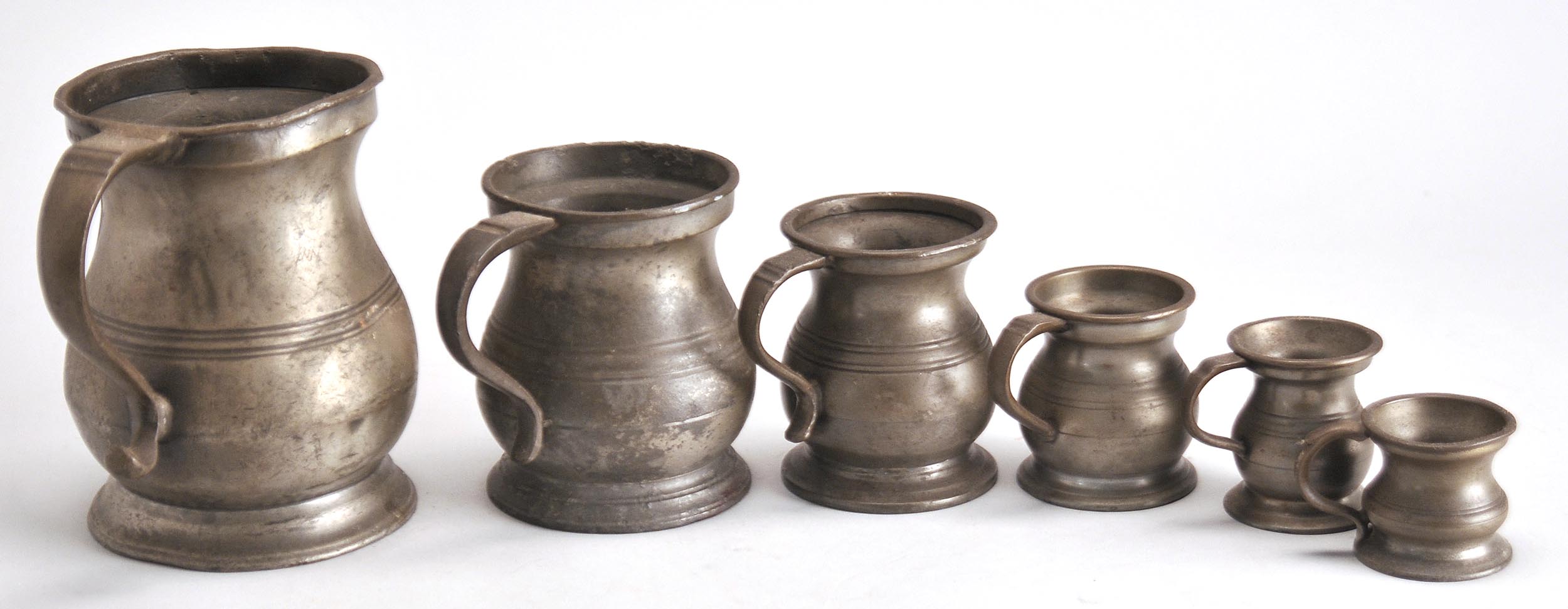 Appraisal: SET OF SIX GRADUATED PEWTER MEASURES Heights from to ConditionWear