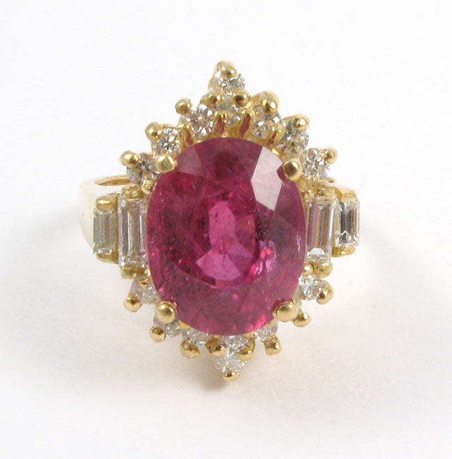 Appraisal: RUBY DIAMOND AND FOURTEEN KARAT GOLD RING centering an oval-cut