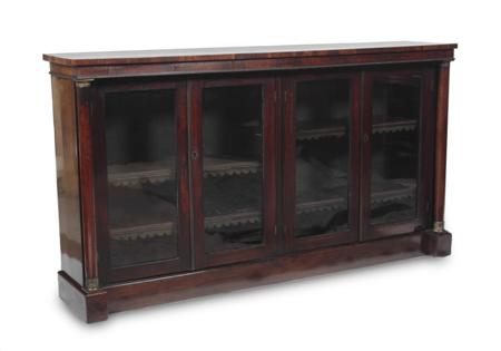 Appraisal: A George IV rosewood low library bookcase with beaded frieze